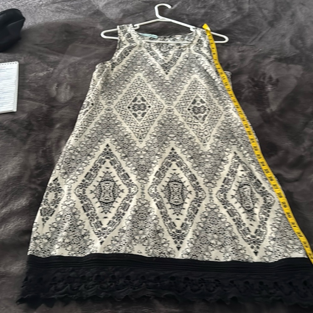 L Maurice’s casual ivory and black dress.